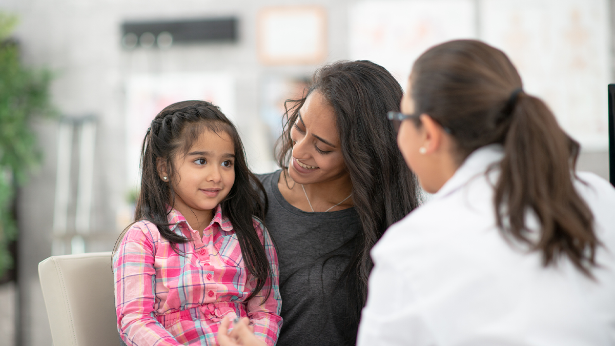 mother and daughter visiting the doctor's office A mother and daughter visiting the doctor's office