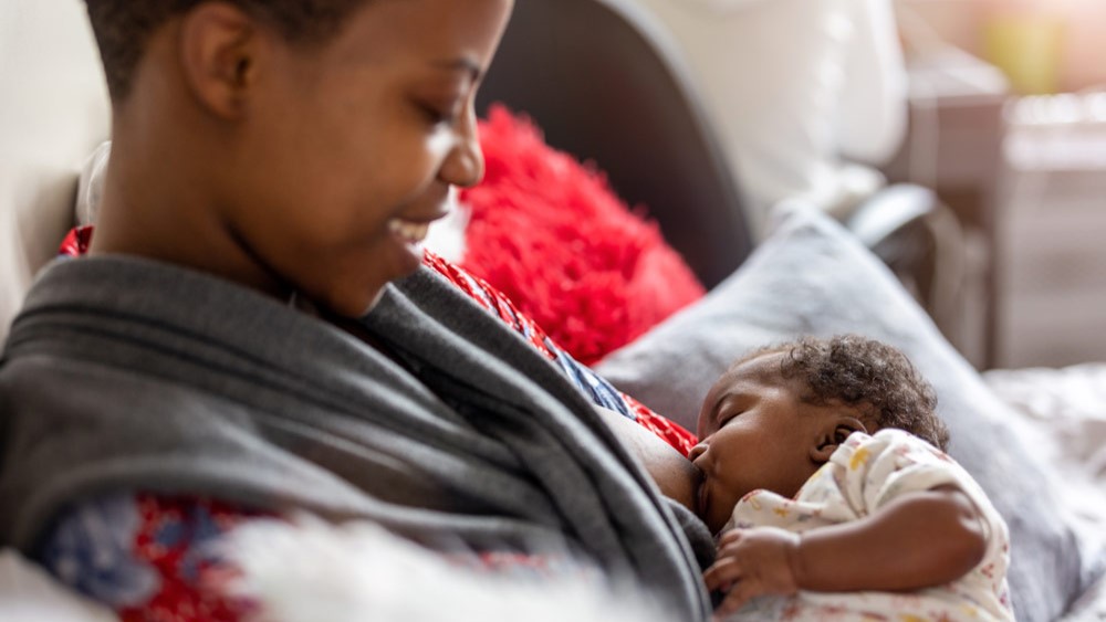 — title missing — Mom breastfeeding her baby.