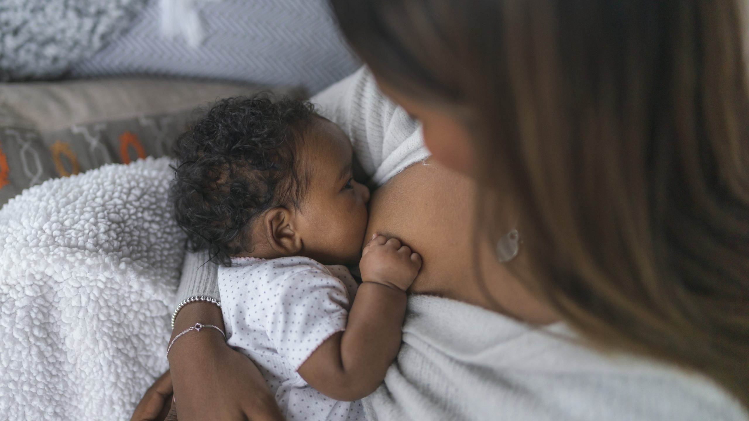Breastfeedingnewborn169.jpg Mother breastfeeding her baby.