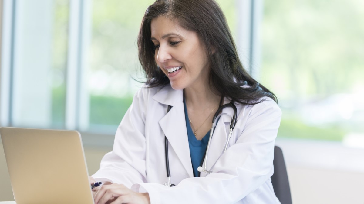 a nurse using a laptop