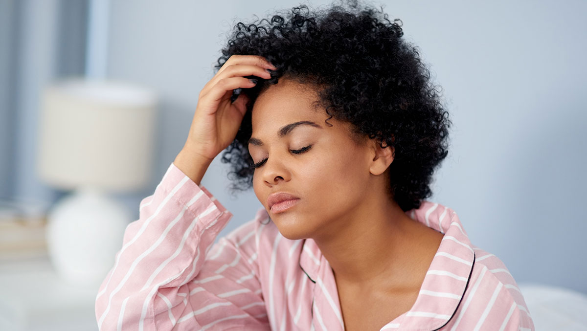GettyImages-1155604402-cr woman in pajamas looking stressed