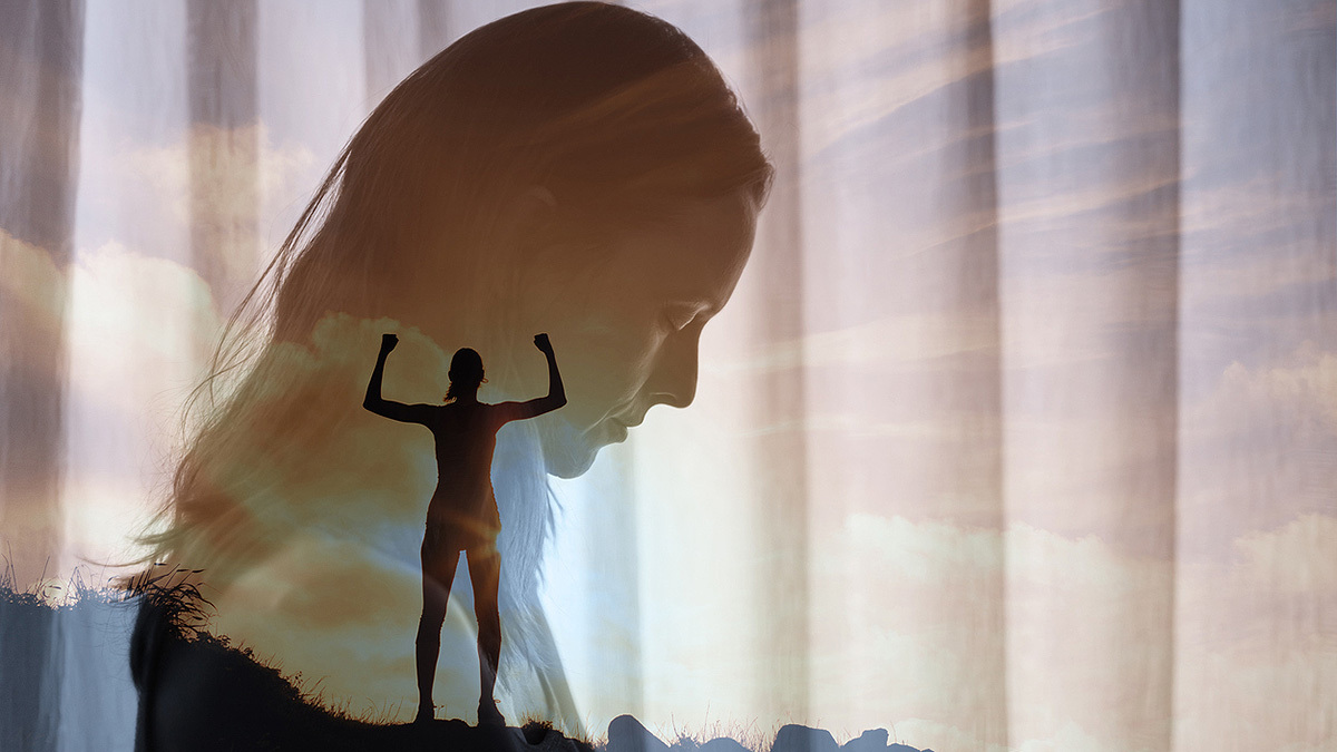 Sad and Triumphant Woman Faded close-up of sad woman, superimposed over triumphant woman silhouette at top of a mountain.