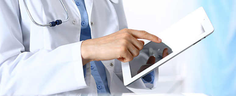 A doctor holding a tablet that shows data. A doctor holding a tablet.