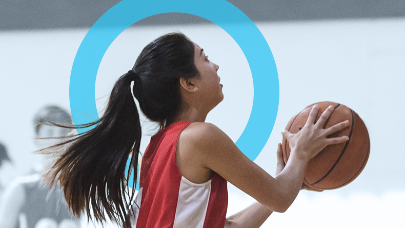 Sports image girl playing basketball