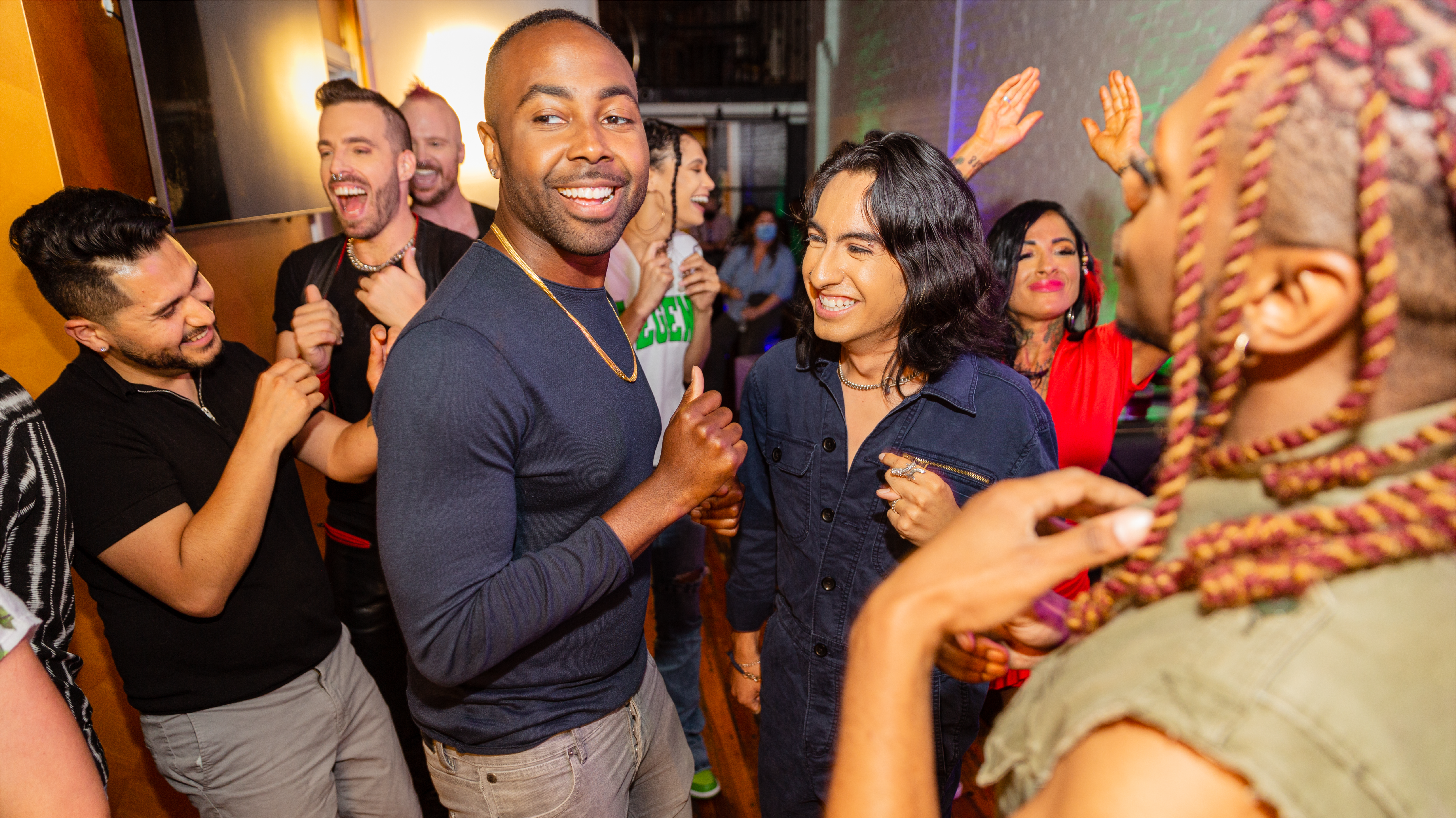 Gay and Bisexual Men Thumbnail Diverse group of people enjoying themselves in a social setting.