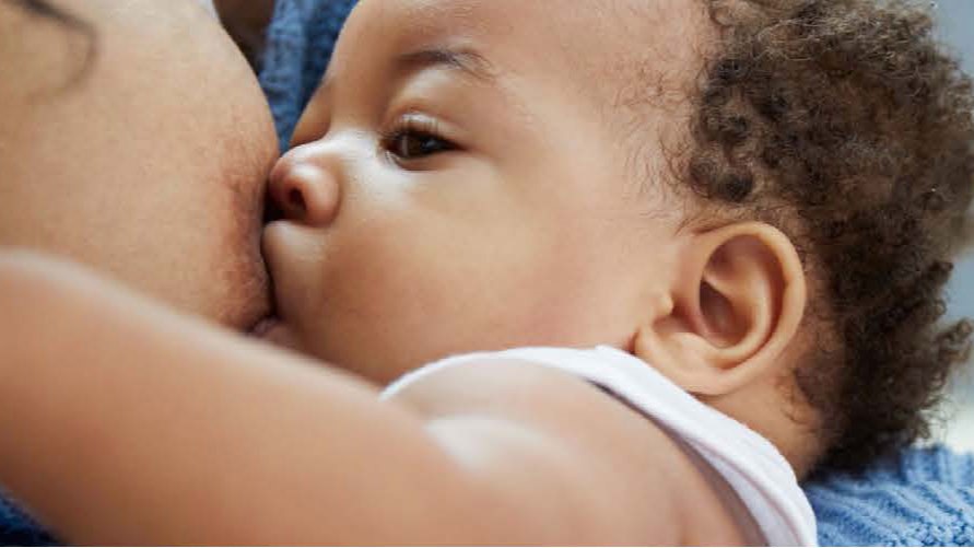 newborn breastfeeding A newborn breastfeeding.