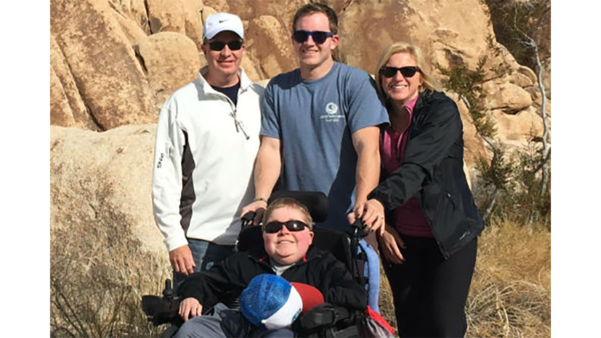 Conor and his family smiling