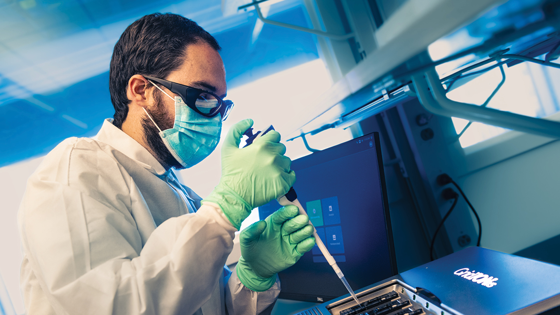 Lab Pipette Photo of a male laboratory worker using a pipette