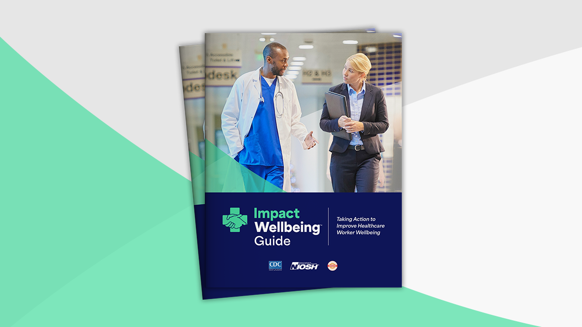 Impact Wellbeing Guide Cover Cover of Impact Wellbeing Guide. A doctor speaks to a listening executive as they walk down a hallway.