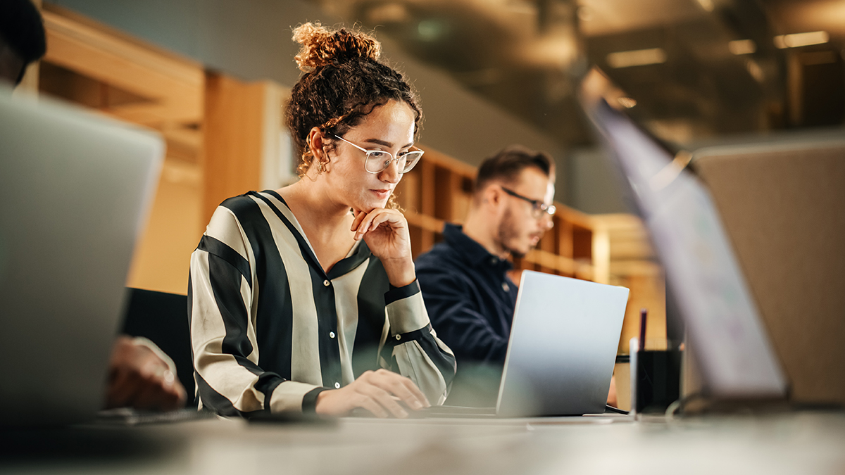 — title missing — Graduate students working on laptops