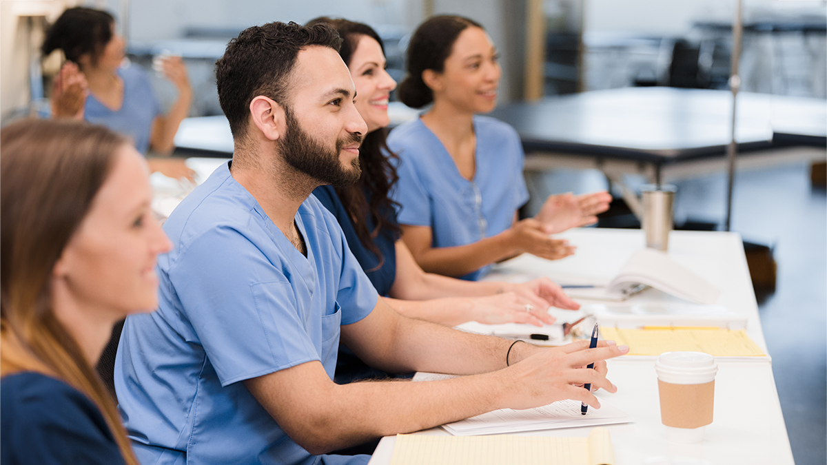 — title missing — Students in scrubs in a classroom.