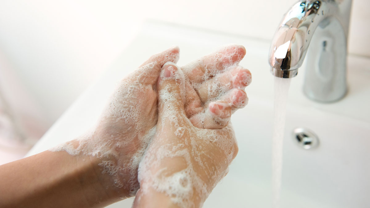 wash-hands-well-1200 Washing of hands with soap under running water.