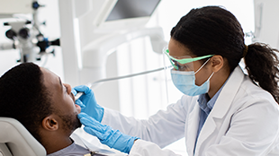 310x200 placeholder Female dentist with male patient