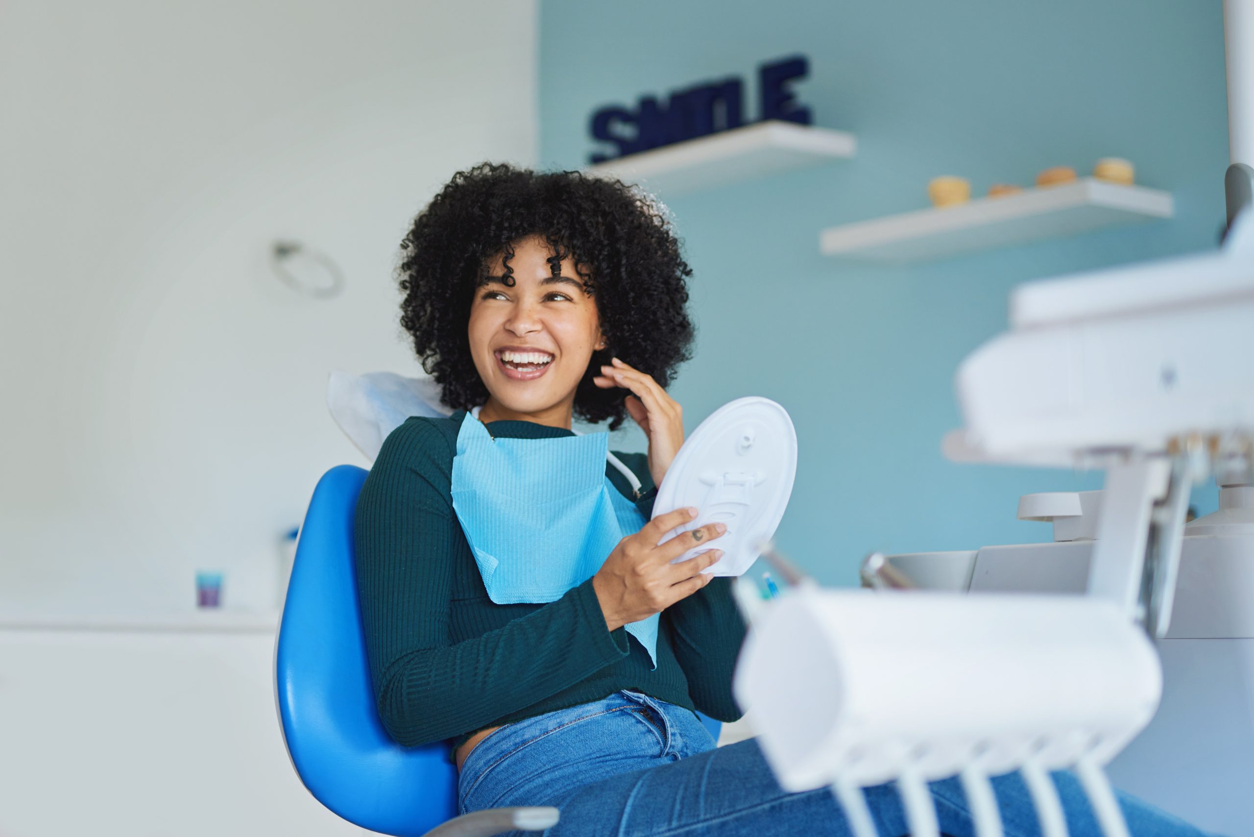 Happy woman in dental chair Happy woman in dental chair