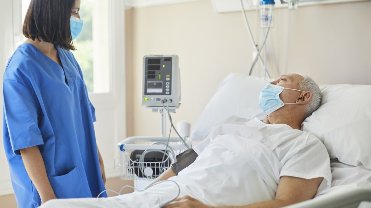 a prostate cancer patient talking with a nurse