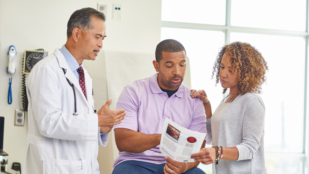 2020 SGR Main Image Doctor reviewing cessation materials with patient and spouse