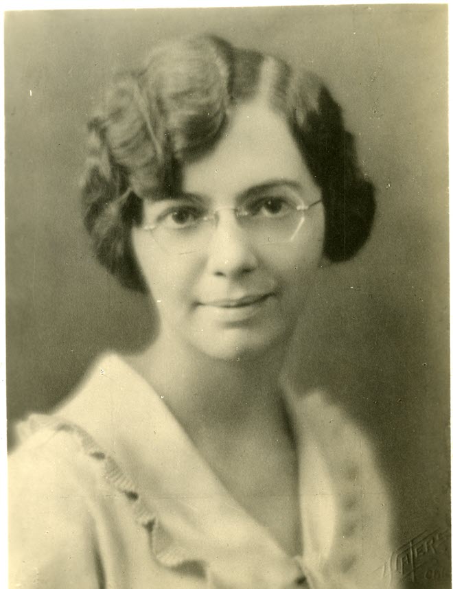 Portrait of Florence Seibert wearing glasses and smiling